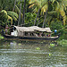 Backwater Bamboo Boating Boatman "Color Image" Cruise Day Forest Greenery "Groups or Crowds" Holding Horizontal Houseboat Kerala Nature Oar Occupation Outdoors "Palm Tree" Rural Standing Tourism Tourist Travel Tree "Vacations & Holidays" Villager Water Wo